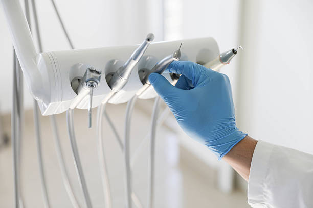 Professional Root Canal Treatment technician working in Johnston County County, NC